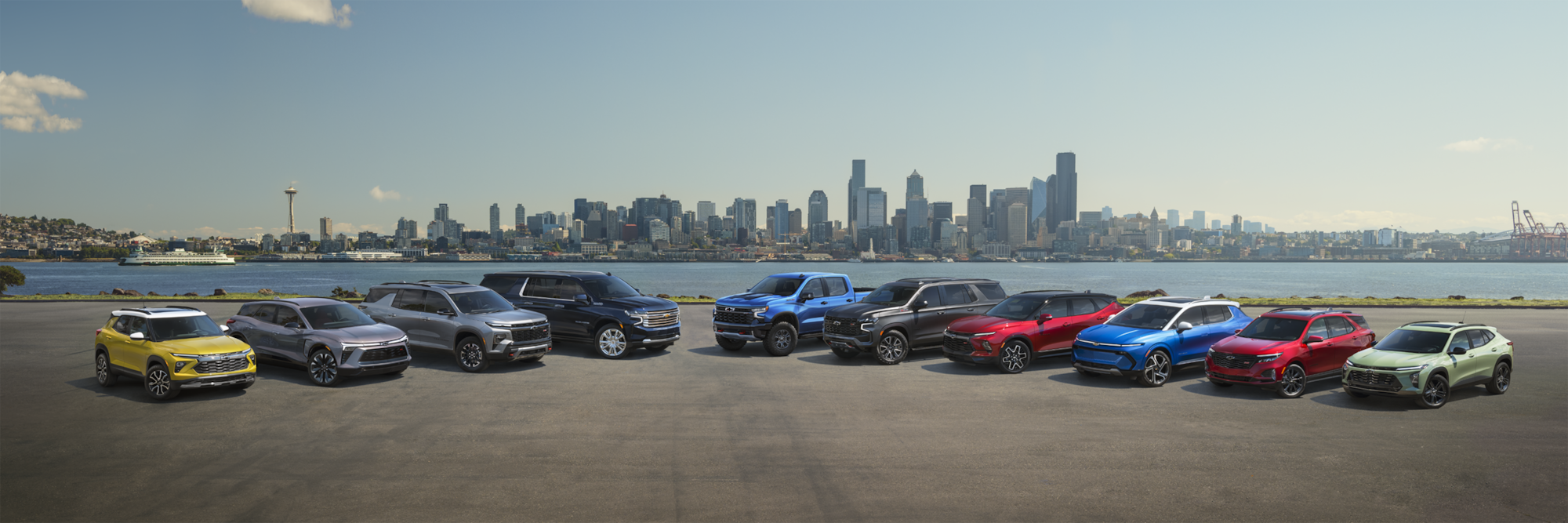 Chevrolet cars parked by a scenic lakeside view