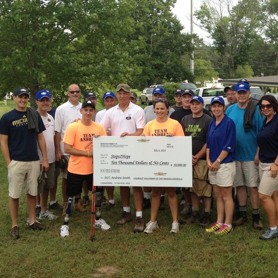 Group holding prize cheque