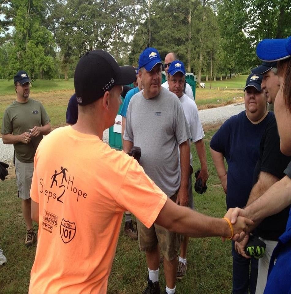 Group photo with handshake in focus
