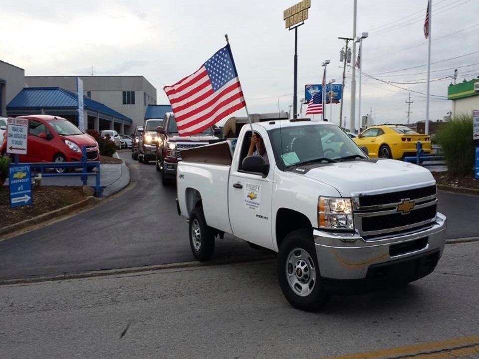 Car in motion with flag waving