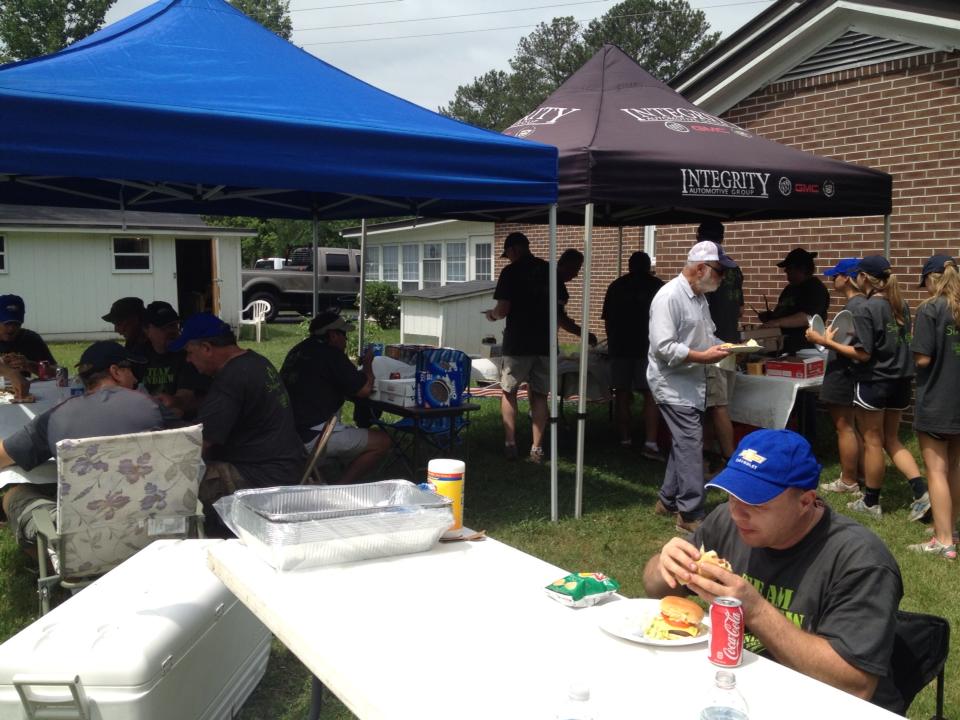 Food stalls bustling with people enjoying meals.