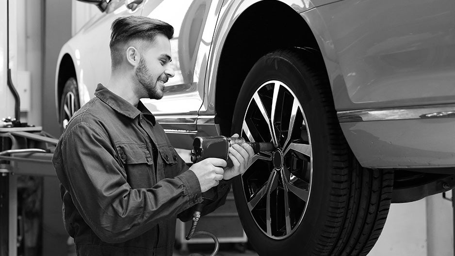 Technician installing tires